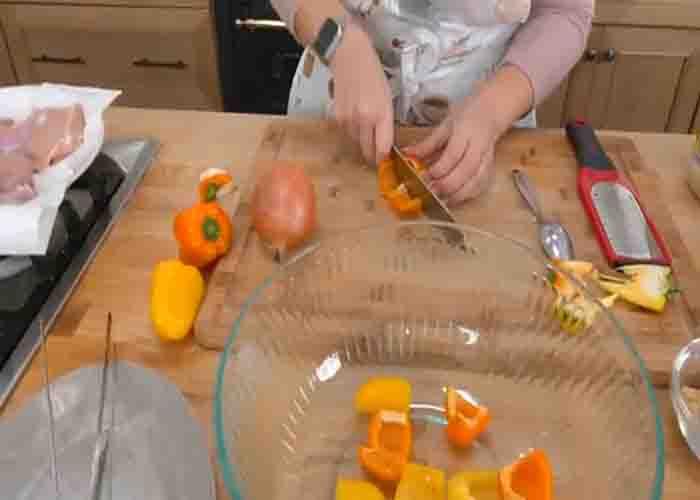 Chopping the bell pepper and onion for the bang bang chicken skewers