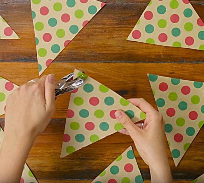 Learn to make a DIY flag garland from old wrapping paper