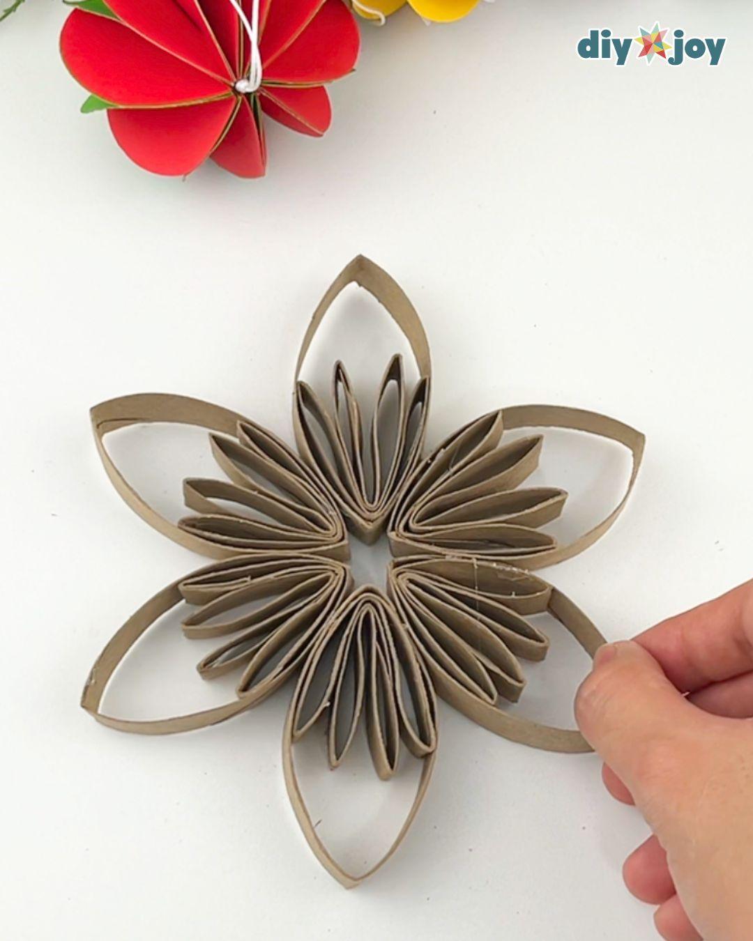 Christmas Ornaments Snowflake Toilet Paper Tubes — gluing the inner layer