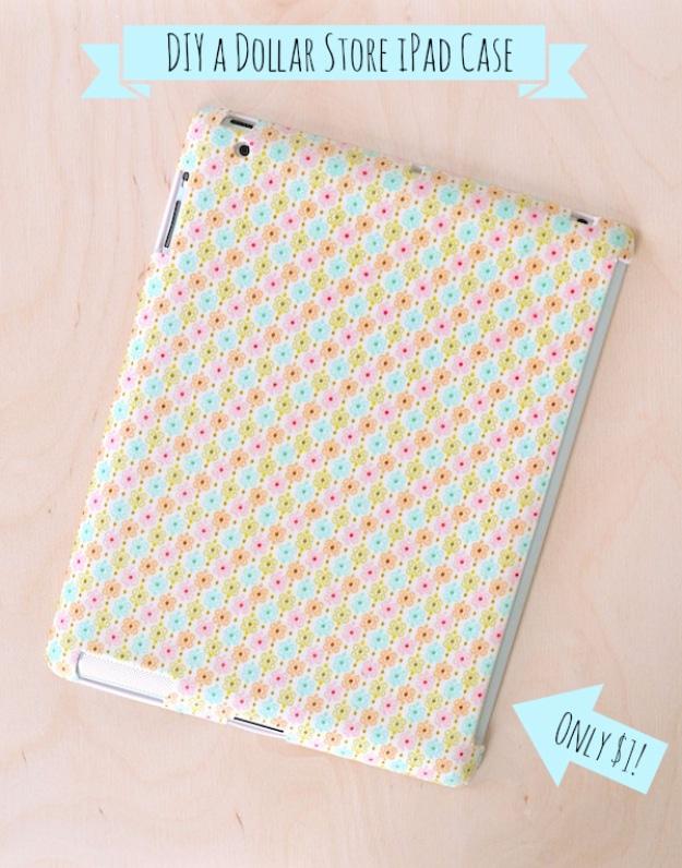 Dollar store tablet case covered in pink and mint floral fabric with a typeset banner reading DIY a Dollar Store iPad Case