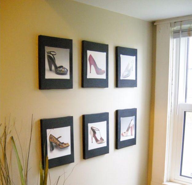 Six small dark framed canvases of shoe photographs from a calendar hung in two rows on a pale cream wall