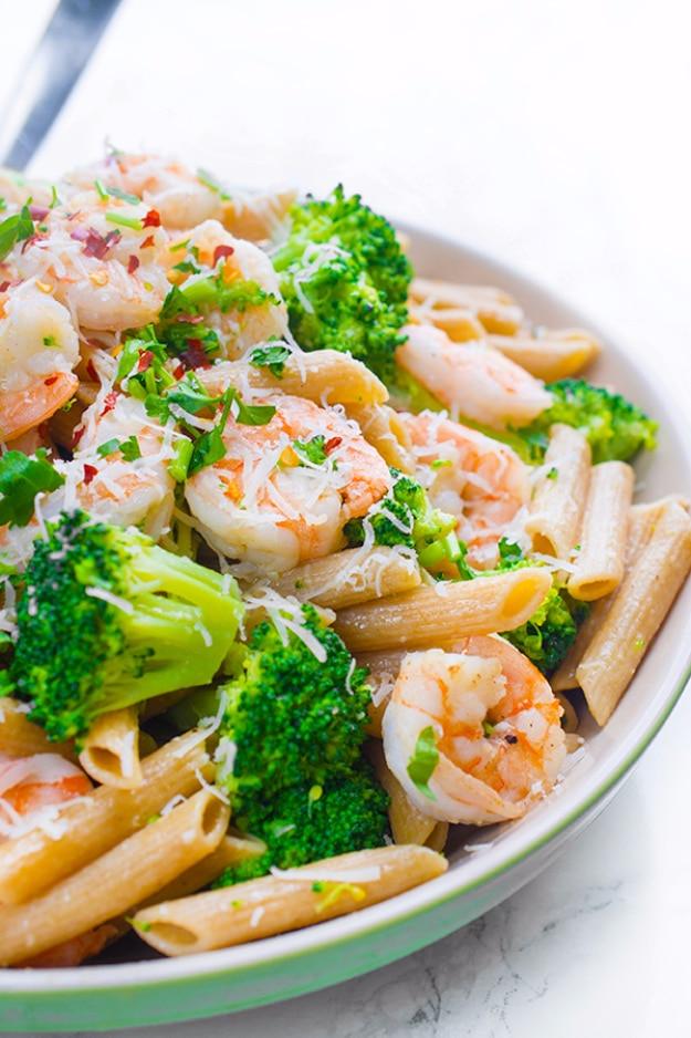 Shrimp and broccoli penne pasta with lemon, garlic and parmesan tossed together in a wide bowl for a fast family dinner
