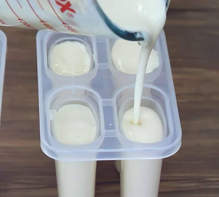 Pouring milk mixture in ice cream mold