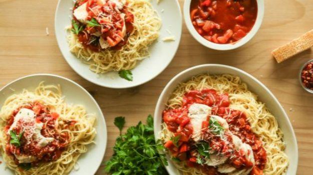 Paul Newman spicy chicken over angel hair pasta in red sauce, a fast celebrity inspired weeknight dinner