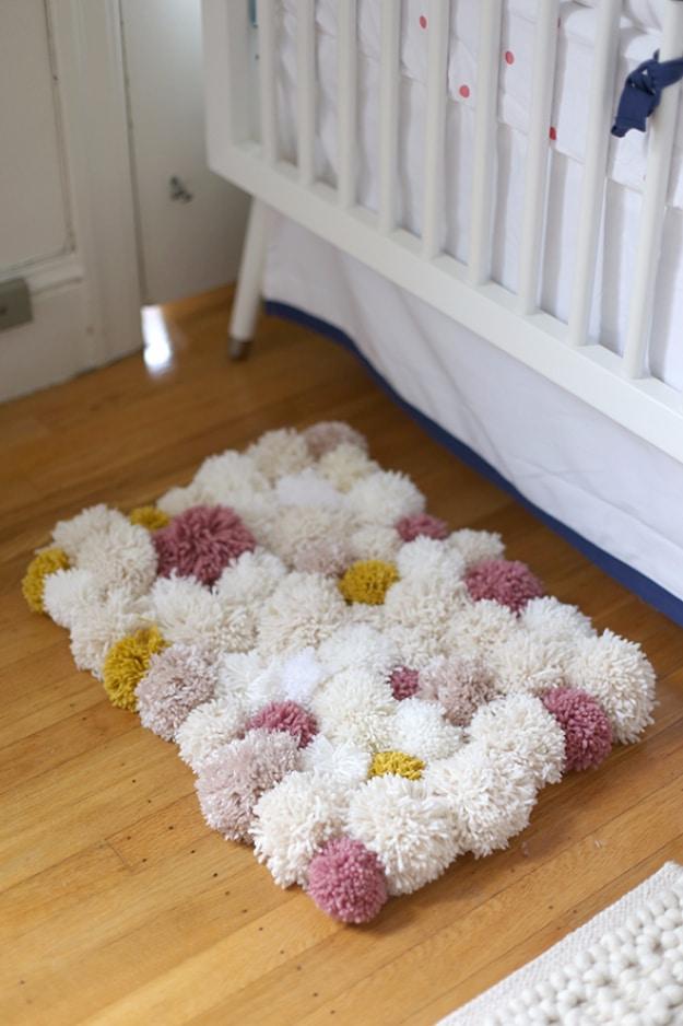 DIY Pom Pom Rug, a fun weekend project using basic supplies and a creative decor piece made almost entirely from yarn