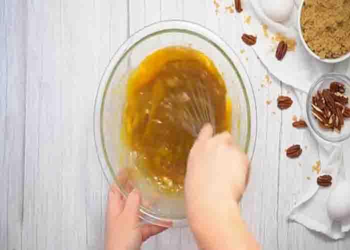 Making the pecan pie bubble up batter