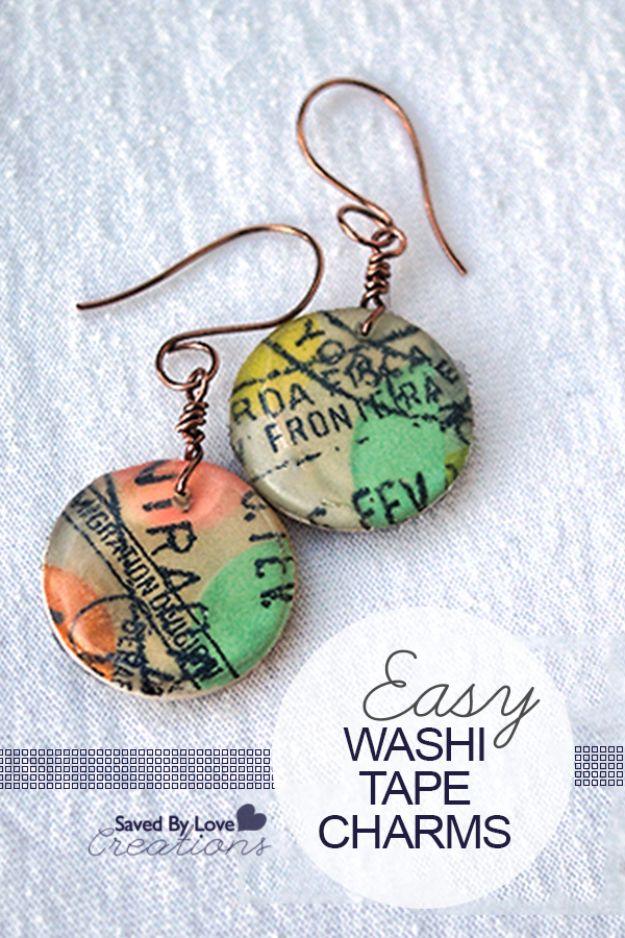 Washi tape earrings, two round map print discs in green and coral on hammered copper wire hooks on white linen