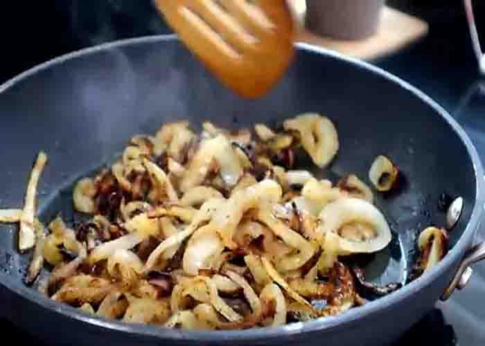 Cooking the onions for the whataburger patty melt