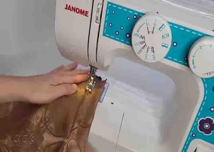 Sewing the bottom of the curtain after cutting it