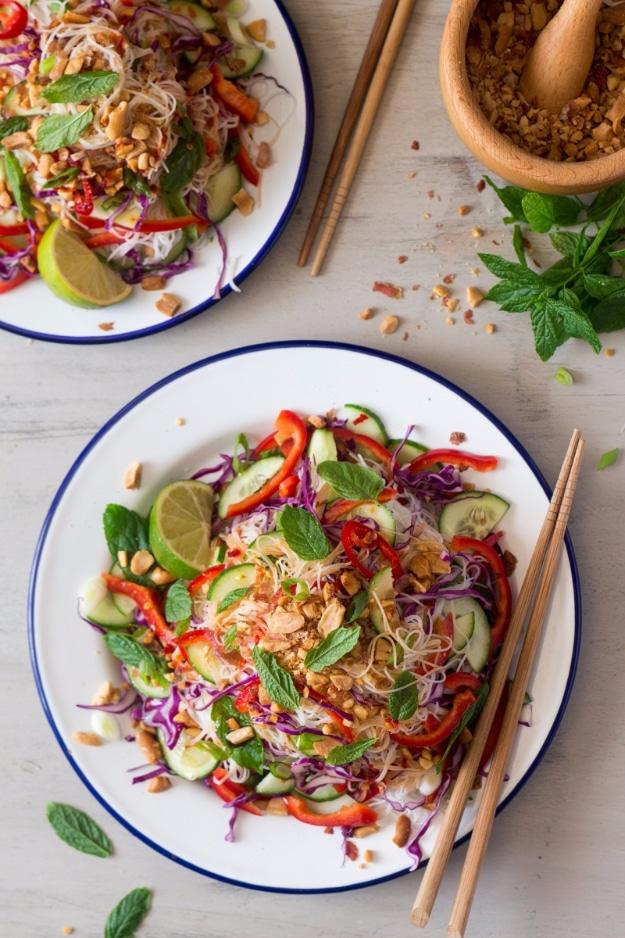 Asian vermicelli noodle salad with shredded red cabbage, cucumber, herbs and crushed roasted peanuts