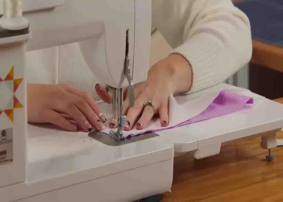 Sewing the strip pieces to make the heartstrings quilt