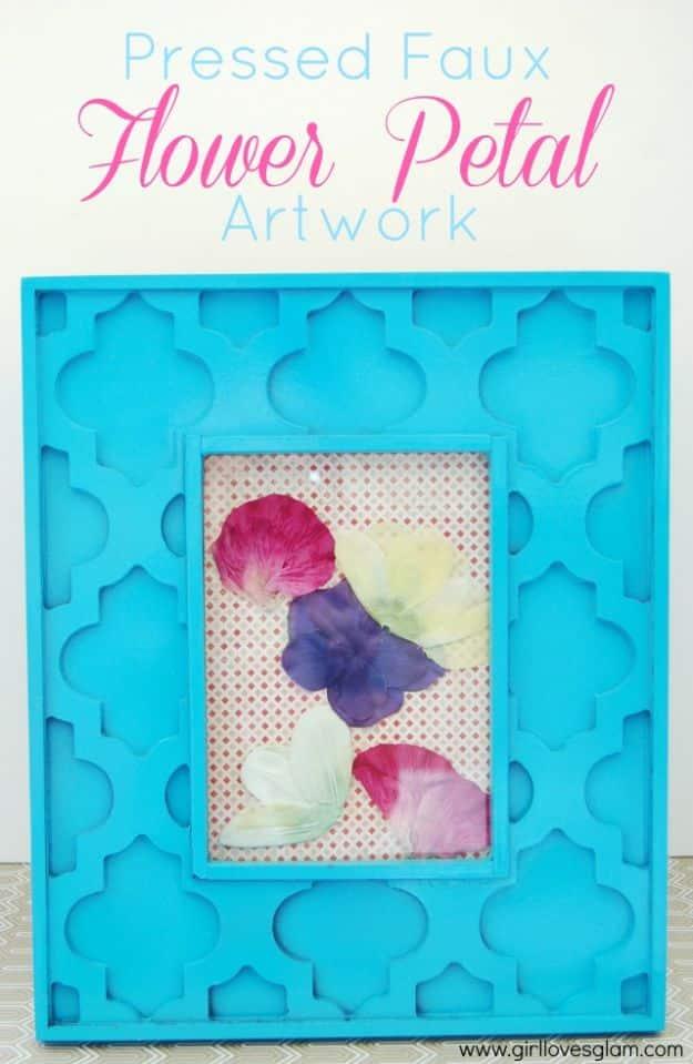 Graphic titled Pressed Faux Flower Petal Artwork over a turquoise frame of pink, purple and cream petals on pink paper