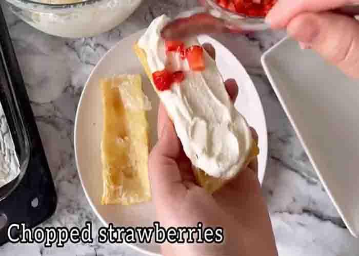 Assembling the strawberry cream puff