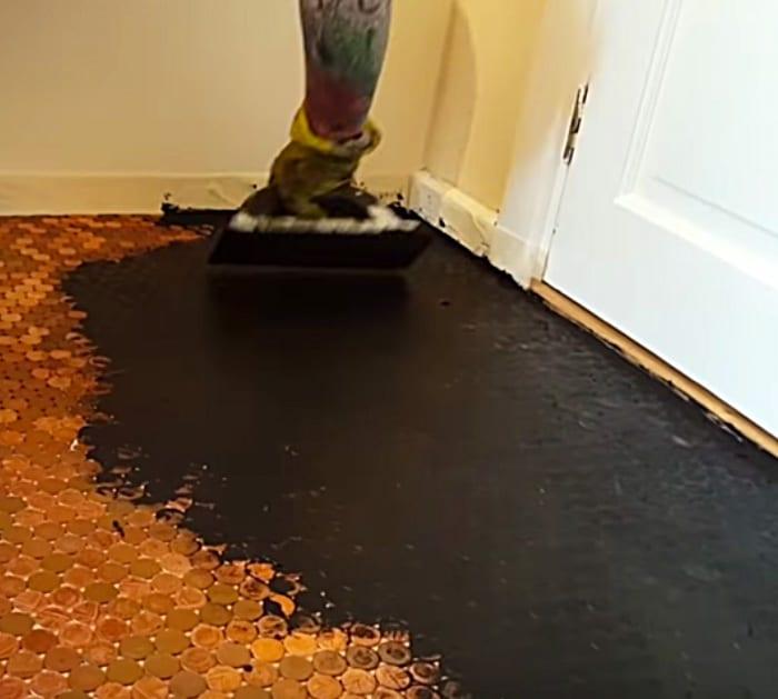 Try a new idea in the bathroom or kitchen by making an epoxy floor made with pennies