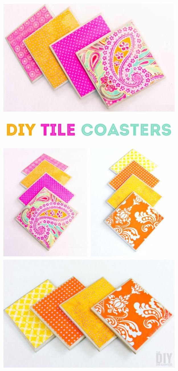 Four white tile coasters with sealed printed images on top, fanned out with one cold drink resting on them, Etsy crafts