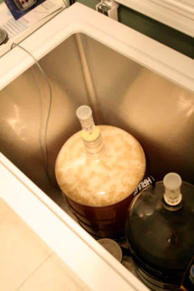 Standard American lager in a glass, pale yellow and clear, with a thin white head and rising bubbles