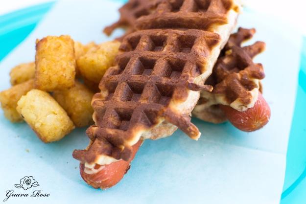 Waffle dogs, a hot dog and its bun pressed together in a waffle iron into one crisp, ridged handheld