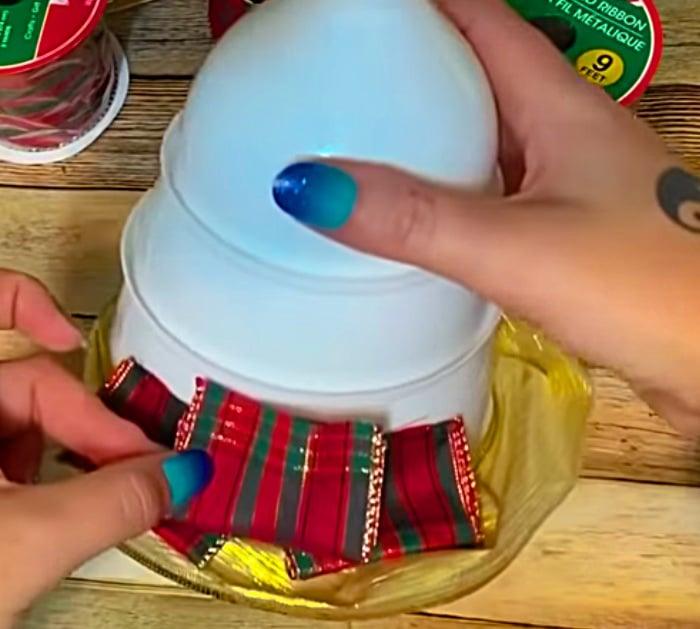Learn to make this DIY Funnel Tree with ribbon and 3 funnels from Dollar Tree