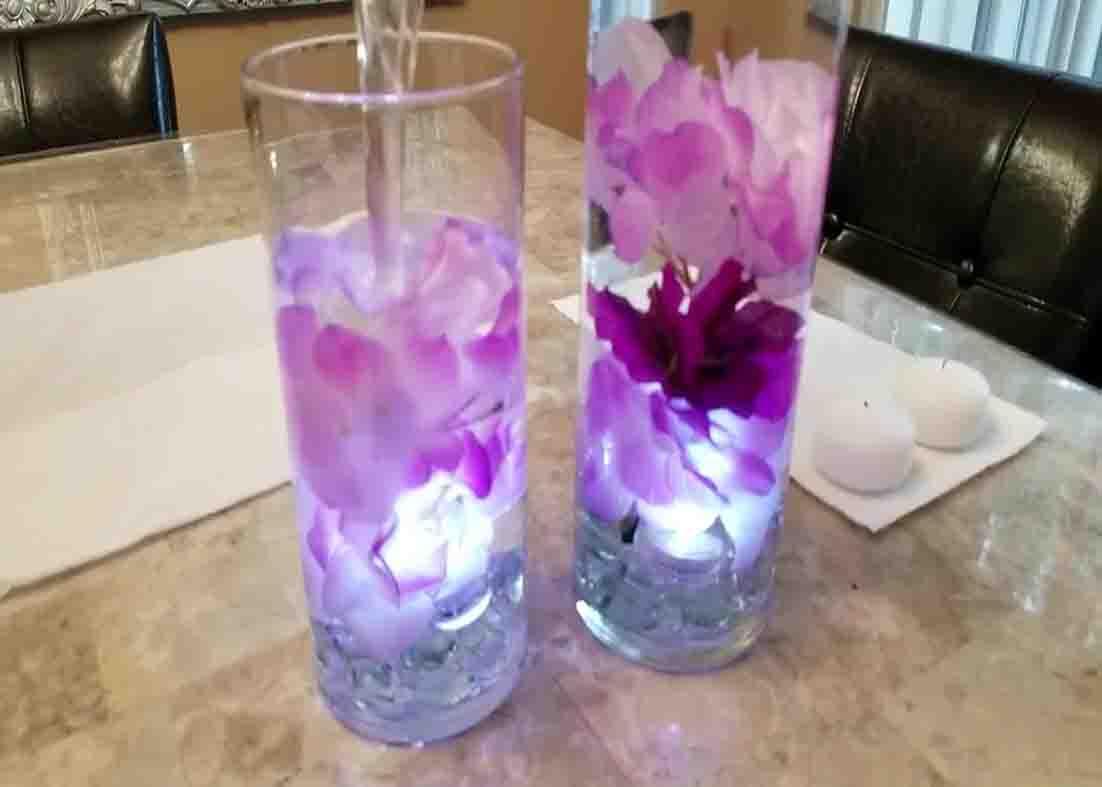 Filling the DIY dollar tree centerpiece with water