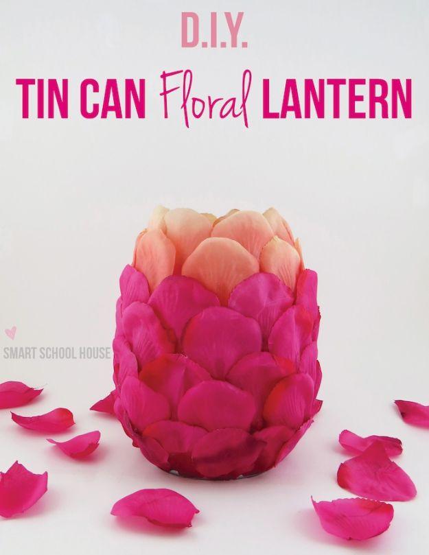 Tin can floral lantern covered in pink and peach fabric rose petals with loose petals scattered on white