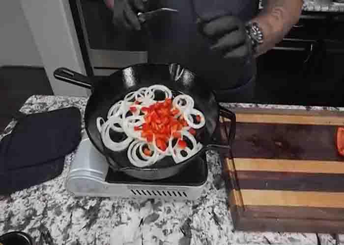 Sauteing the onion and red bell pepper for the Southern skillet potatoes recipe