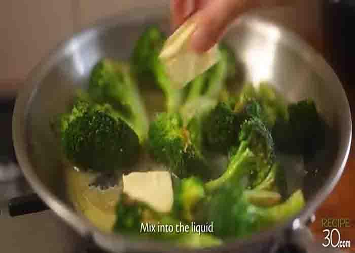 Adding the butter to the broccoli