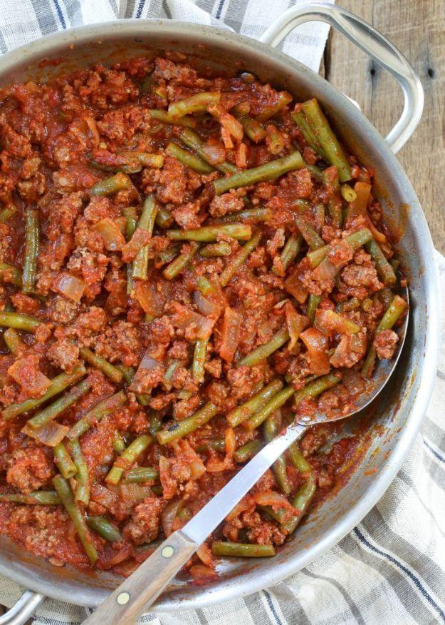 Lebanese beef and green beans simmered in a tomato sauce and served over creamy garlic smashed potatoes