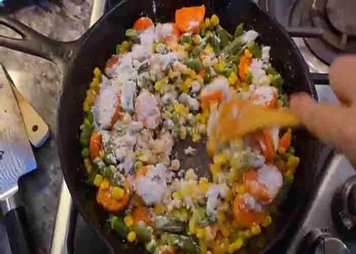 Sauteing the mixed veggies for the chicken cobbler