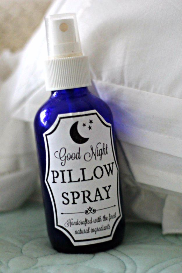 Good night pillow spray printable label on a cobalt glass spray bottle against white bedding and pillows