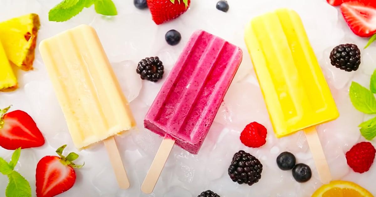 Three smoothie popsicle recipes frozen in silicone molds in tropical, mixed berry and just peachy flavors