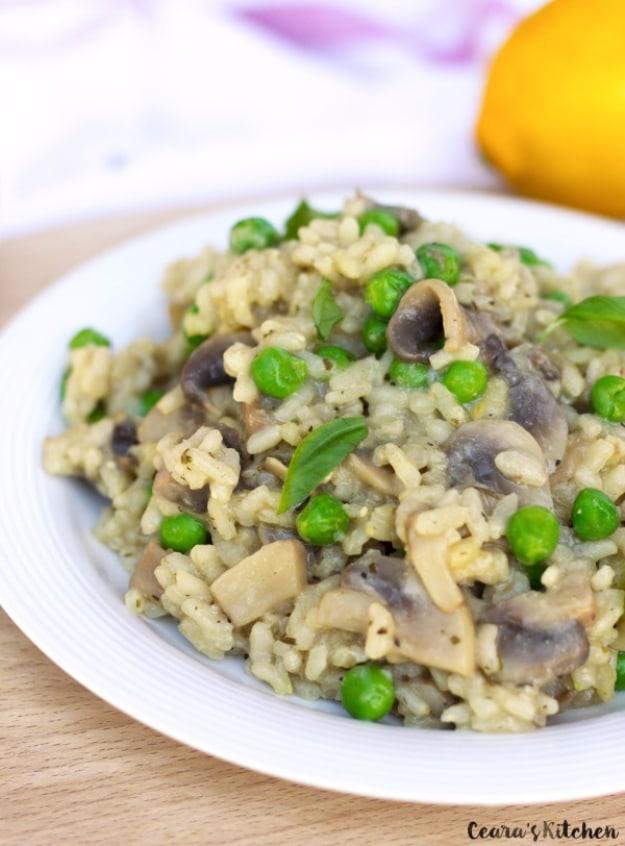 Creamy vegan mushroom risotto with sauteed mushrooms and fresh herbs served in a wide shallow bowl ready to serve at home