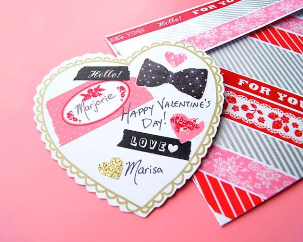 Washi tape Valentine's card on a heart shaped doily with a matching washi decorated envelope beside it