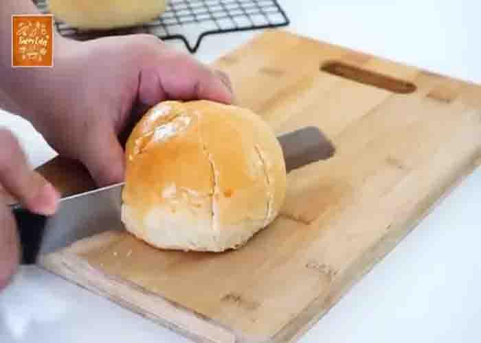 Slicing the cream cheese garlic buns