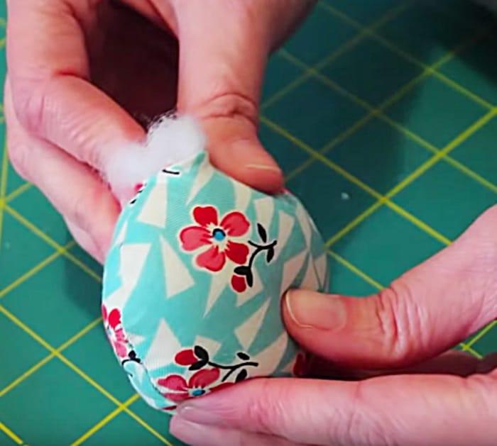 Learn to sew a DIY Petal Pincushion from fabric scraps and poly stuffing