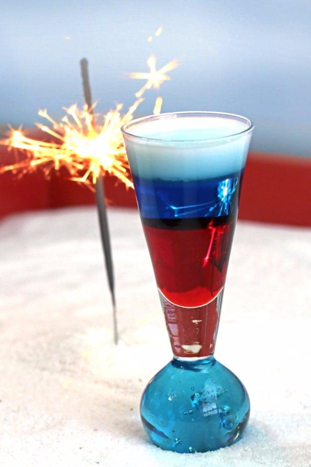 4th of July party idea: a layered shooter cocktail mixed so the colors stay separate in the glass for the whole family