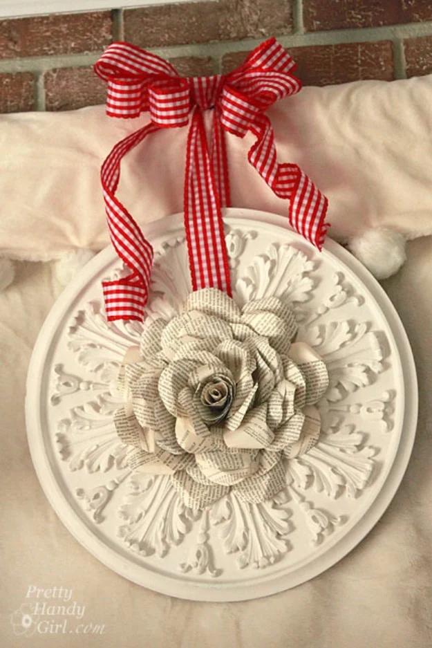 Book page rose wreath with a large paper rose built on a white ceiling medallion, hung with red gingham ribbon