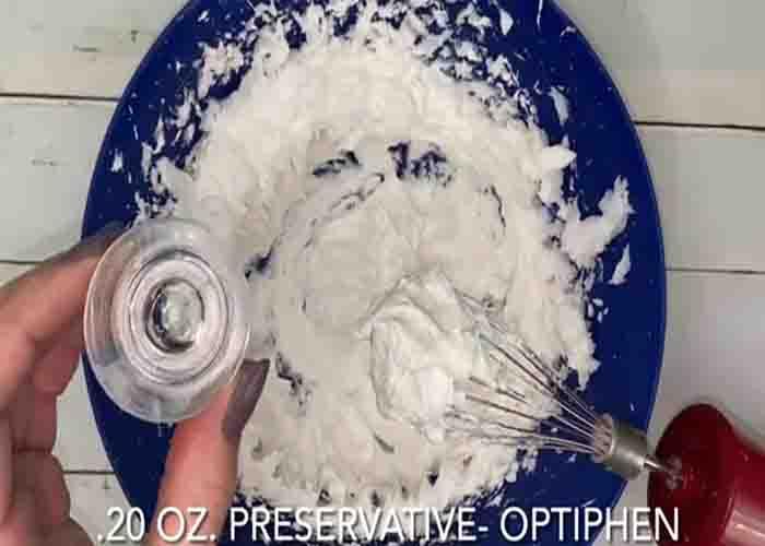Mixing the ingredients to make the whipped soap