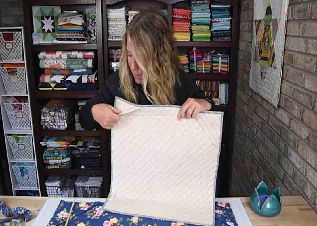 Making pockets to the quilt and hanging it using a dowel rod