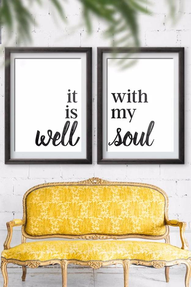 It is well with my soul printable art, the phrase split across two black framed prints hanging above a yellow velvet settee