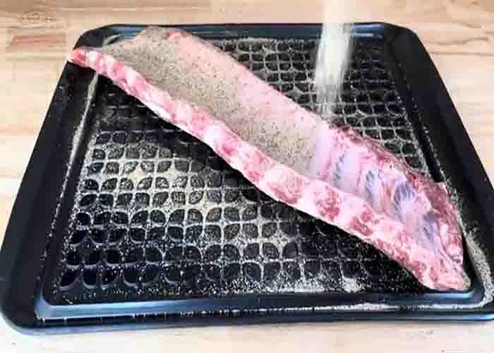 Seasoning the orange fanta ribs