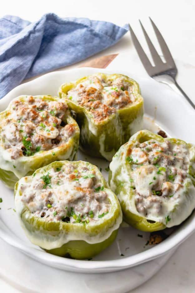 Philly cheesesteak stuffed peppers with ground beef, sliced mushrooms, onions and melted provolone cheese