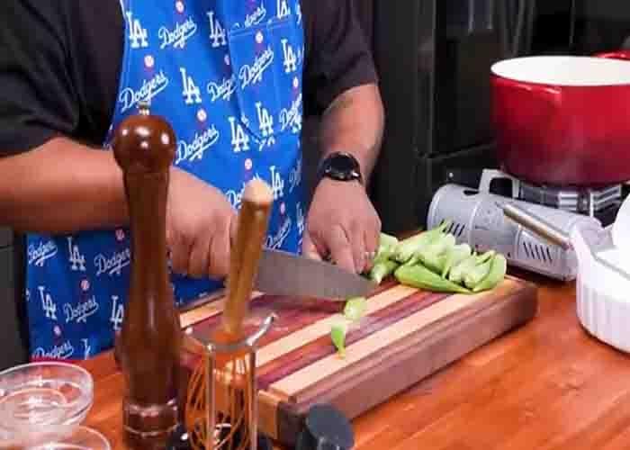 Chopping the okra to bite size pieces