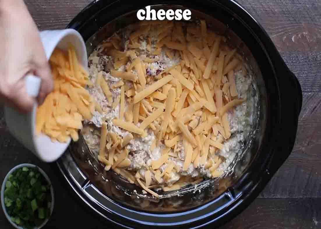 Adding the cheese over the top of the chicken