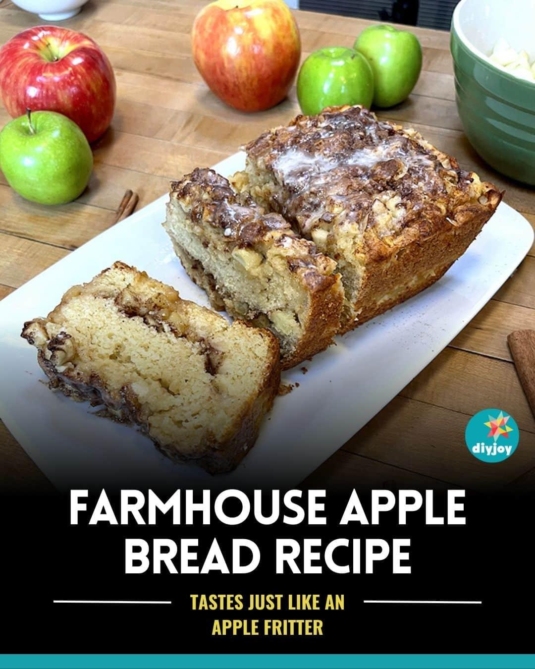 Farmhouse apple bread sliced on a white plate with red and green apples around it and a cinnamon swirl visible