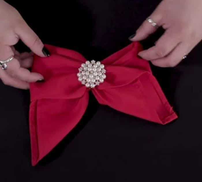 How to fold napkin into Christmas themed idea