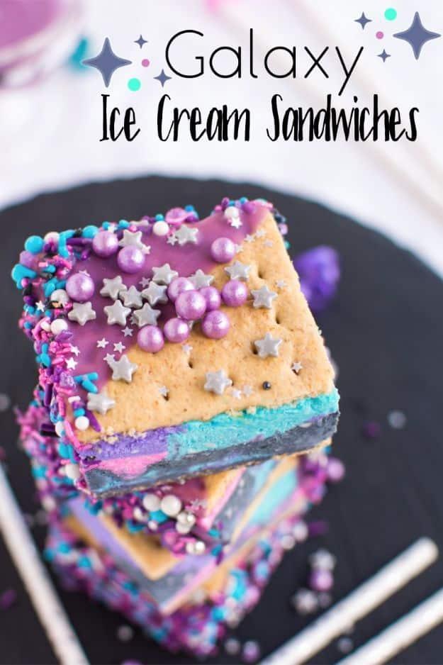 Galaxy ice cream sandwiches swirled in black, purple, pink and blue no churn ice cream with sprinkles