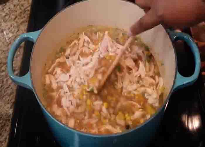 Adding the rotisserie chicken to the white chicken chili