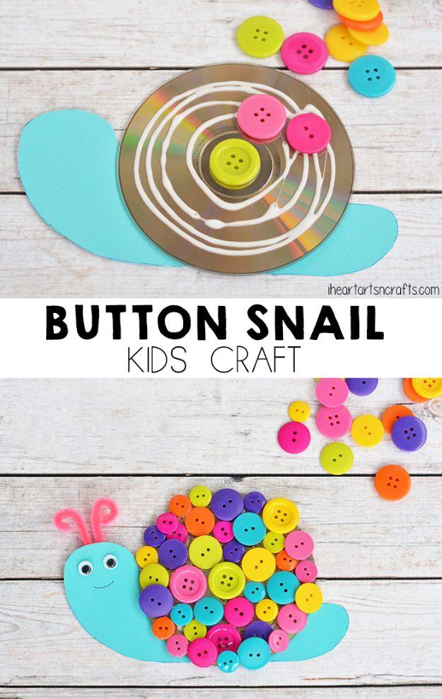 Turquoise cardstock snail with a shell of brightly colored buttons glued on a CD, with pipe cleaner antennae