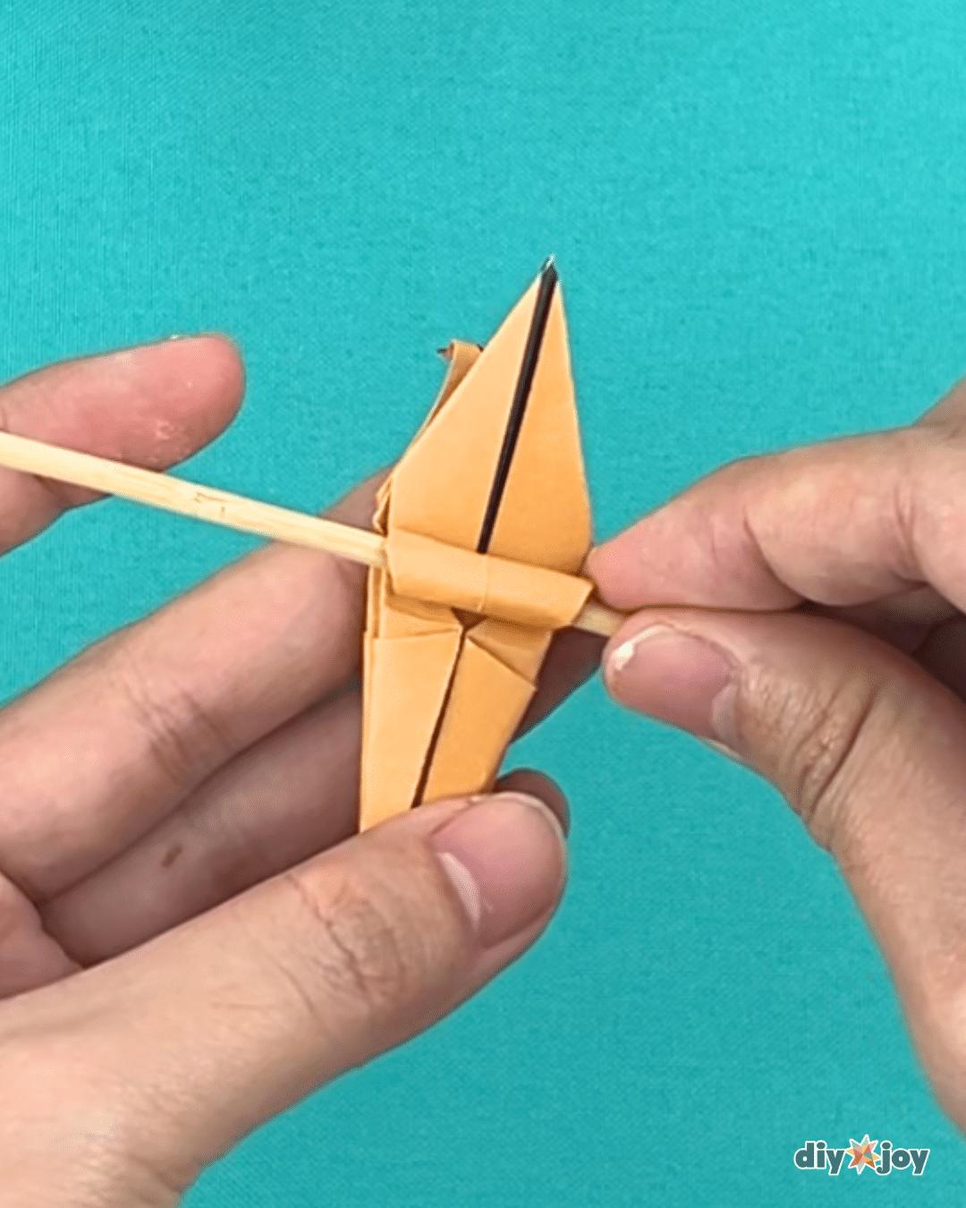 Easy paper lily flowers made from square colored paper, a low cost DIY craft project for spring decorating