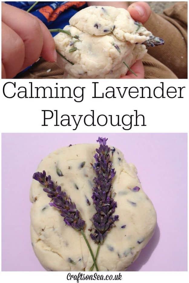Pale lavender scented playdough with purple buds pressed in, with fresh lavender stems on a pink surface